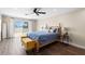Cozy bedroom with wooden floors, bright natural light, and beautiful water views at 4331 13Th Ne Way, St Petersburg, FL 33703