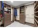 Spacious walk-in closet with built-in shelving and drawers for optimal storage at 4331 13Th Ne Way, St Petersburg, FL 33703