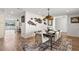 Beautiful dining room features modern decor, stylish furniture, and a chic light fixture at 4331 13Th Ne Way, St Petersburg, FL 33703