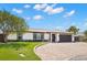 Charming one-story home with a well-manicured lawn and a brick driveway at 4331 13Th Ne Way, St Petersburg, FL 33703
