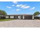 Charming one-story home with manicured lawn and a circular brick driveway at 4331 13Th Ne Way, St Petersburg, FL 33703
