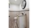 Cozy half bathroom with decorative mirrors, vanity, and hardwood floors at 4331 13Th Ne Way, St Petersburg, FL 33703