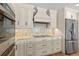 Elegant kitchen featuring stainless steel appliances, custom cabinets, and granite countertops at 4331 13Th Ne Way, St Petersburg, FL 33703