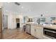 Spacious kitchen with granite counters, stainless appliances, and a beverage fridge for modern convenience at 4331 13Th Ne Way, St Petersburg, FL 33703