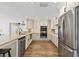 Bright, renovated kitchen with granite countertops, stainless steel appliances, and modern cabinetry at 4331 13Th Ne Way, St Petersburg, FL 33703