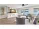 The beautifully decorated living room features waterfront views and an open design to the outdoor living space at 4331 13Th Ne Way, St Petersburg, FL 33703