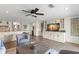 Cozy living room with open kitchen, built-in cabinets, and an entertainment center for ultimate relaxation at 4331 13Th Ne Way, St Petersburg, FL 33703