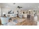 The light-filled living room boasts wood floors, stylish decor, and an open layout to the modern kitchen at 4331 13Th Ne Way, St Petersburg, FL 33703