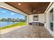 Tile patio overlooking a tranquil canal, with storage units and a wooden ceiling at 4331 13Th Ne Way, St Petersburg, FL 33703