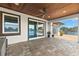 Covered patio with wood ceiling, tile floor, ceiling fan, and scenic water views at 4331 13Th Ne Way, St Petersburg, FL 33703