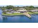 Waterfront home featuring private dock and pool with covered patio at 4331 13Th Ne Way, St Petersburg, FL 33703