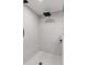 Tiled walk-in shower with grid floor and rainfall shower head at 4331 13Th Ne Way, St Petersburg, FL 33703
