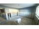 Bathroom under renovation featuring gray walls, a new toilet, and exposed wall studs at 4570 Overlook Ne Dr # 180, St Petersburg, FL 33703