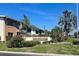 Exterior view of the Lake Overlook Condominiums, with beautiful landscaping at 4570 Overlook Ne Dr # 180, St Petersburg, FL 33703