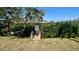 Community dock and grass area with shady trees and water view at 4570 Overlook Ne Dr # 180, St Petersburg, FL 33703