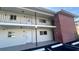 A well-maintained condo with a brick accent wall and a welcoming white facade at 4570 Overlook Ne Dr # 180, St Petersburg, FL 33703