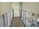 Hallway during remodel phase with the drywall cut out, leading to the exterior door at 4570 Overlook Ne Dr # 180, St Petersburg, FL 33703