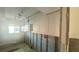 Kitchen during remodel phase with the cabinets and microwave installed at 4570 Overlook Ne Dr # 180, St Petersburg, FL 33703