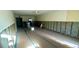 Renovated living room with blue-taped flooring, exposed walls, and ceiling fan at 4570 Overlook Ne Dr # 180, St Petersburg, FL 33703