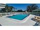 Outdoor community pool with plenty of seating at 4570 Overlook Ne Dr # 180, St Petersburg, FL 33703