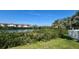Scenic water view from community area with lush greenery at 4570 Overlook Ne Dr # 180, St Petersburg, FL 33703