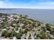 Aerial view of residential neighborhood with homes near a body of water at 460 4Th S St, Safety Harbor, FL 34695