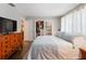 Bedroom featuring hardwood floors, television and a large closet at 460 4Th S St, Safety Harbor, FL 34695