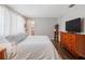 Bedroom featuring hardwood floors and an ensuite bathroom at 460 4Th S St, Safety Harbor, FL 34695