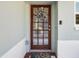 Elegant front door adorned with a floral wreath, welcoming guests to this charming home at 460 4Th S St, Safety Harbor, FL 34695