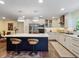 Modern kitchen featuring a large island with bar seating, stainless steel appliances, and custom cabinetry at 460 4Th S St, Safety Harbor, FL 34695