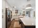 A view of the kitchen showing the island and stainless steel appliances at 460 4Th S St, Safety Harbor, FL 34695