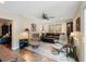 Spacious living room with a leather sofa, comfortable seating, and a ceiling fan at 460 4Th S St, Safety Harbor, FL 34695