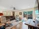 Cozy living room with hardwood floors, leather seating, and access to a patio at 460 4Th S St, Safety Harbor, FL 34695