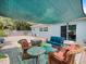 Relax on this shaded patio featuring outdoor seating and string lights at 460 4Th S St, Safety Harbor, FL 34695