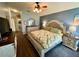 Comfortable bedroom with a neutral color palette, ceiling fan, and decorative pillows at 4740 Carrington Ct # 4740, New Port Richey, FL 34655