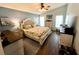 Comfortable bedroom with a neutral color palette, ceiling fan, and decorative pillows at 4740 Carrington Ct # 4740, New Port Richey, FL 34655