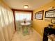 Cozy dining area illuminated by decorative lighting and a picturesque view at 4740 Carrington Ct # 4740, New Port Richey, FL 34655