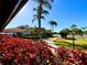 Beautiful building with landscaping and a sidewalk on a sunny day at 4740 Carrington Ct # 4740, New Port Richey, FL 34655