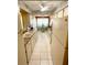 Galley kitchen features a small breakfast nook with a small table and two chairs at 4740 Carrington Ct # 4740, New Port Richey, FL 34655