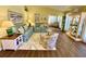 Cozy living room featuring tile floors, comfortable sofas, and nautical decorations at 4740 Carrington Ct # 4740, New Port Richey, FL 34655