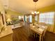 A dining area and living area are brightened by ample natural light and decor at 4740 Carrington Ct # 4740, New Port Richey, FL 34655