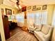 Bright home office with a desk, chair, rug, and natural light from the window at 4740 Carrington Ct # 4740, New Port Richey, FL 34655