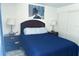 Cozy bedroom with a queen bed, nightstands, and a closet at 5225 Coquina Key Se Dr # B, St Petersburg, FL 33705
