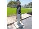 ChargePoint EV charging station on a concrete slab with palm trees and green lawn surroundings at 5225 Coquina Key Se Dr # B, St Petersburg, FL 33705