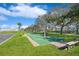 Outdoor shuffleboard courts with trees and lush green surroundings, perfect for recreation at 5225 Coquina Key Se Dr # B, St Petersburg, FL 33705