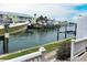 Waterfront view of canal with docks and boats, townhouses in the background at 5225 Coquina Key Se Dr # B, St Petersburg, FL 33705
