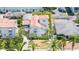 An aerial view showing the exterior and a beautiful white stucco home with terra cotta tile roof at 53 Albemarle Ave, Tampa, FL 33606