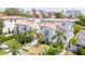 A high angle view of several homes with manicured lawns, tile roofs and downtown skyline at 53 Albemarle Ave, Tampa, FL 33606