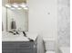 Bathroom with modern vanity, countertop, and new fixtures; marble tile in shower at 53 Albemarle Ave, Tampa, FL 33606