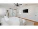 Bright bedroom with TV and access to the bathroom via a sliding barn door at 53 Albemarle Ave, Tampa, FL 33606